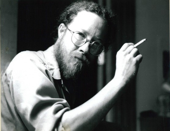 Artist Thorpe Feidt bearded, smoking cigarette looking into camera