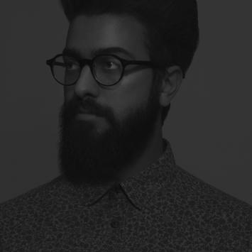 Black and white photo of a man's portrait with beard