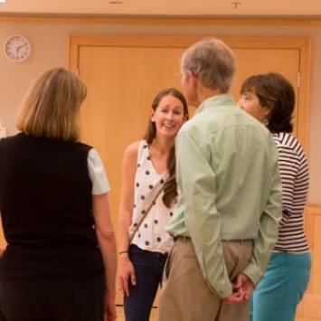 Group of people talking in a gallery